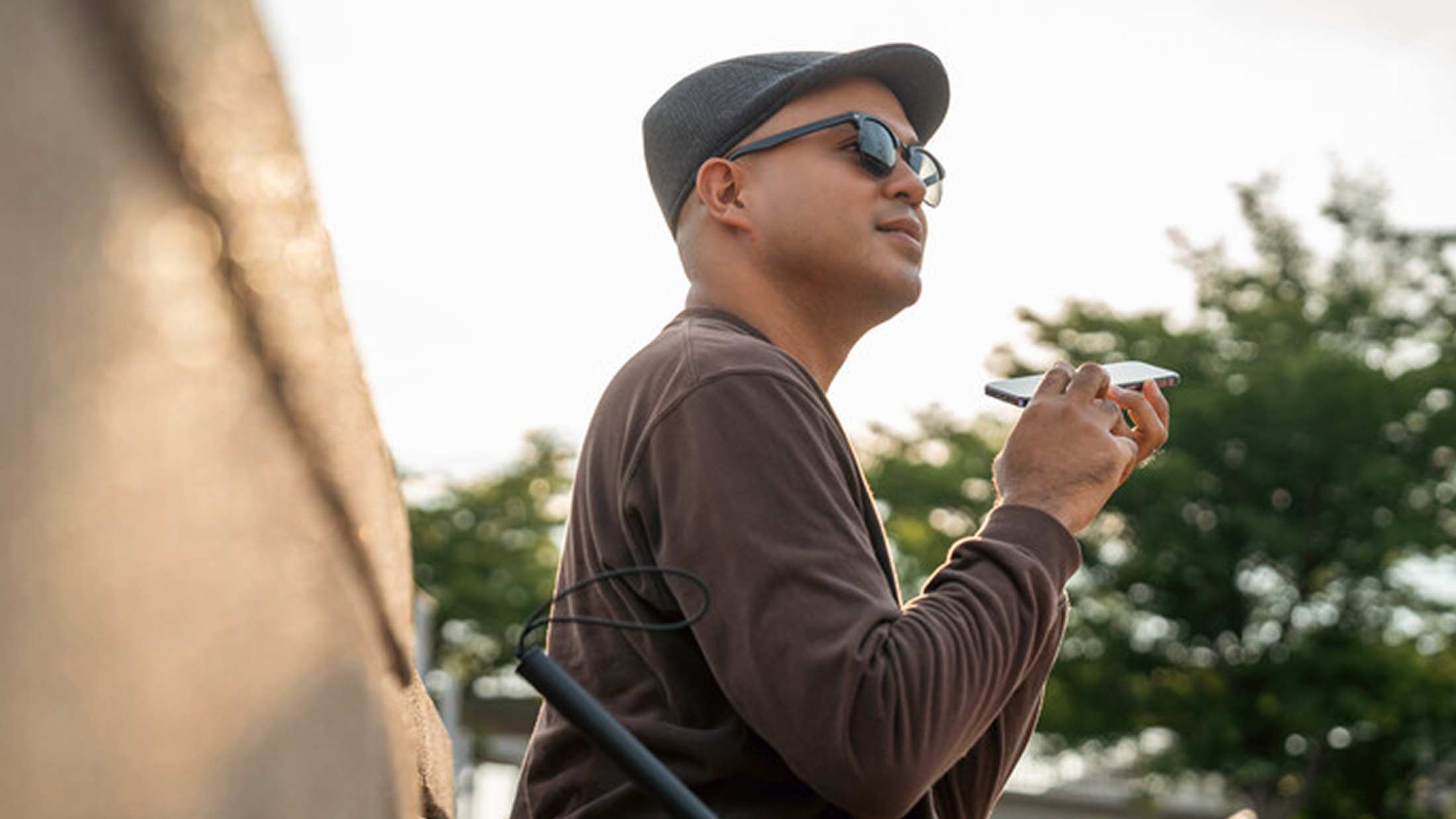 Outdoor man playing his harmonica