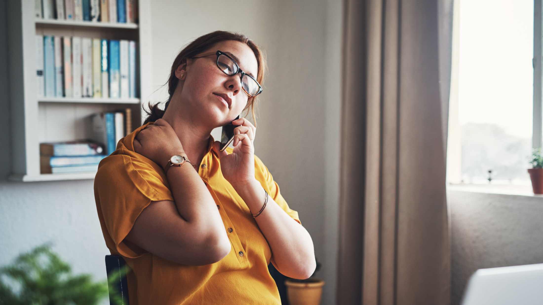A tired woman calling on the phone